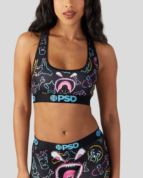 Black sports bra with colorful neon line-drawn monster faces and PSD waistband.