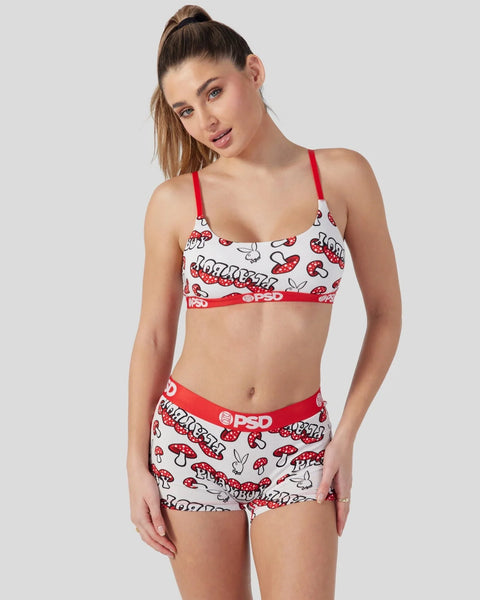 Red and white two-piece set with mushroom print and red straps and waistband.
