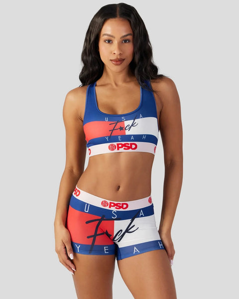 Woman wearing red, white and blue striped sports bra and shorts set with text graphics and PSD branding.