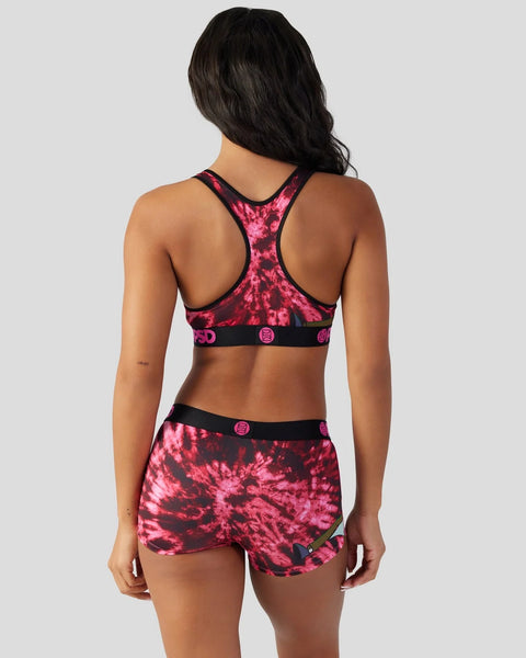 Pink and black tie-dye sports bra and shorts set with racer back design, shown from back view.