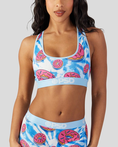 Sports bra with blue tie-dye and pink donut print, light blue elastic waistband with branding.