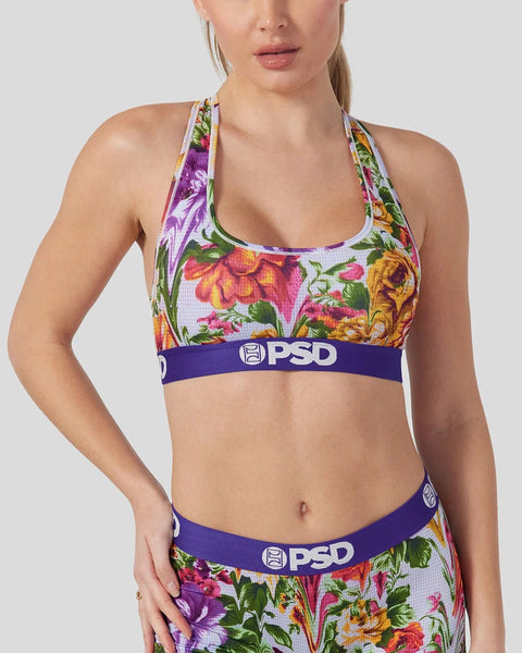 Women's sports bra and briefs set with multicolor floral tapestry print and PSD brand waistband.