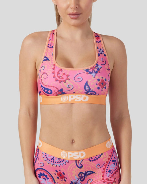 Pink sports bra with blue and purple paisley print and orange PSD waistband.