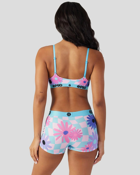 Two-piece underwear set with blue straps, pink and purple floral pattern on checkered background, and branded waistband.