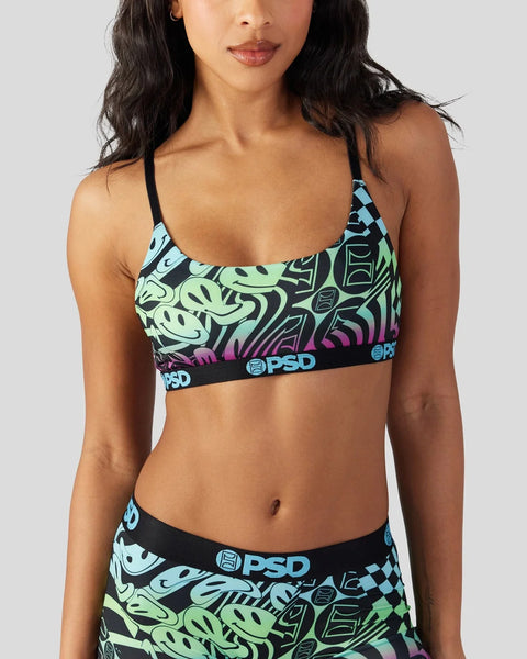 Sports bra with neon green, blue, and purple abstract pattern and black PSD waistband.
