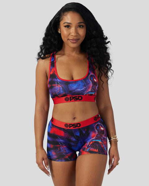 Women's sports bra and shorts set with red and blue abstract print and red PSD waistband.