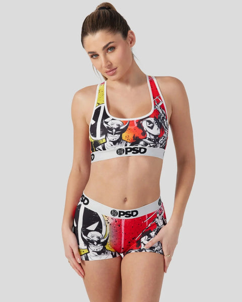 Women's sports bra and shorts set with Deadpool and Wolverine character graphics in red, yellow, black and white.