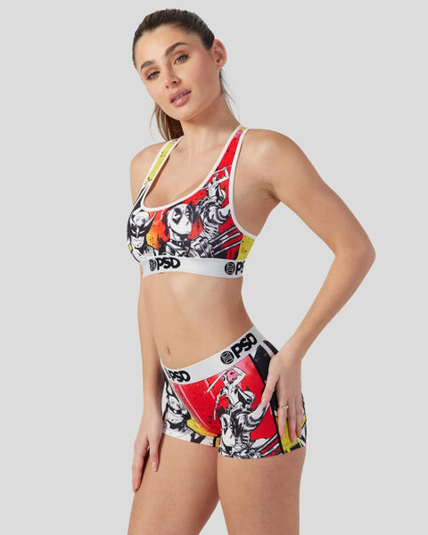 Woman wearing red and black Marvel Deadpool and Wolverine sports bra and shorts set with character graphics and PSD branding.