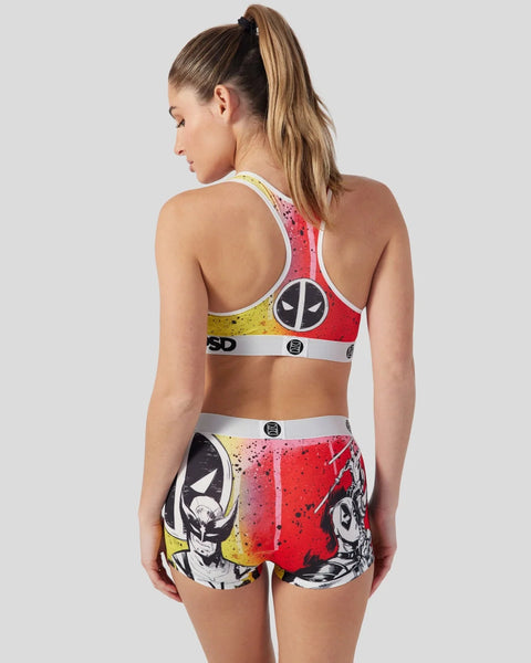 Women's sports bra and shorts set in red and yellow with Deadpool character graphics and logo details.