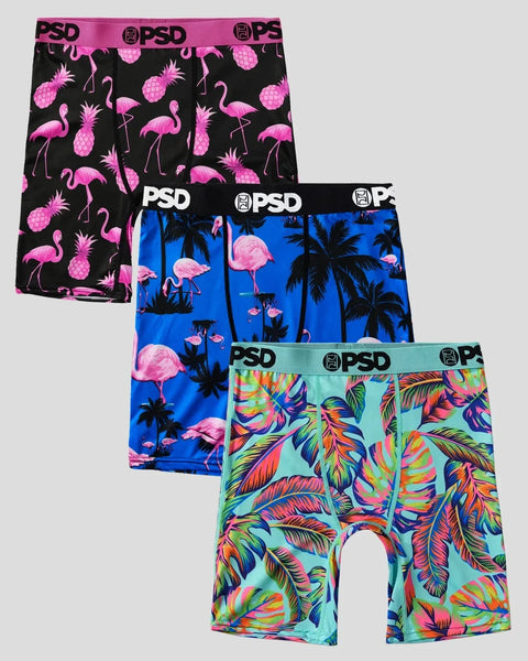 Three boxer briefs with pink flamingos and pineapples on black, pink flamingos and palm trees on blue, and colorful feathers 