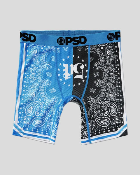Blue and black PSD bandana-print boxer briefs with star and paisley patterns, white stripes, and elastic waistband.