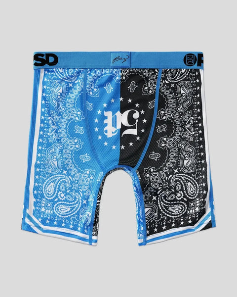 Blue and black bandana-print boxer briefs with star and paisley patterns, white trim, and 