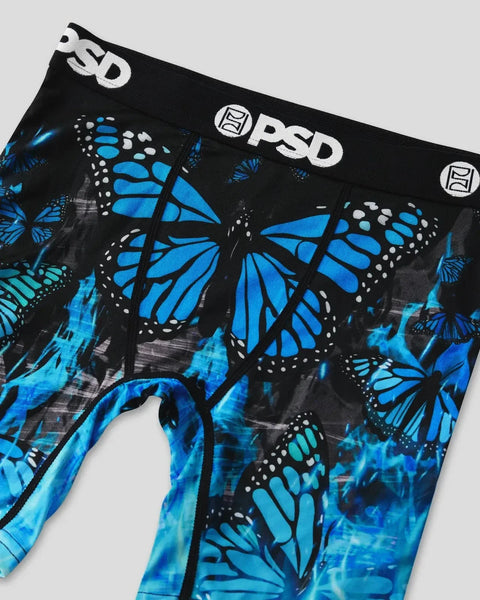 Black briefs with blue and cyan butterfly pattern, white PSD branding on waistband.