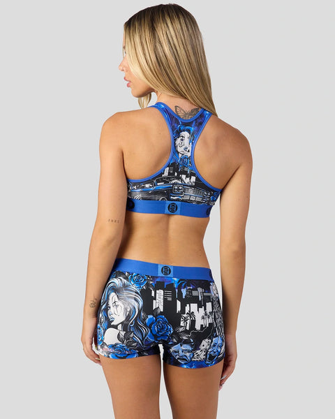 Blue and black two-piece athletic set with lowrider car and portrait graphic print, racer-back sports bra and matching shorts