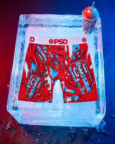 Red and blue ICEE-print boxer briefs with PSD waistband, displayed on ice with frozen drink cup above.