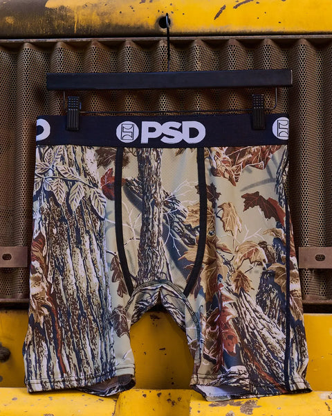 PSD Realtree Xtra Grey men's boxer briefs with camouflage print featuring tree bark and foliage patterns in gray, cream, and 