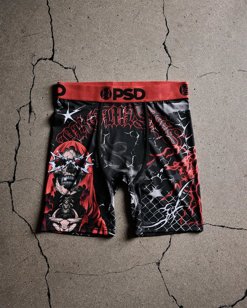 PSD brand boxer briefs with red waistband featuring black base with red skull imagery, lightning bolts, and text graphics.