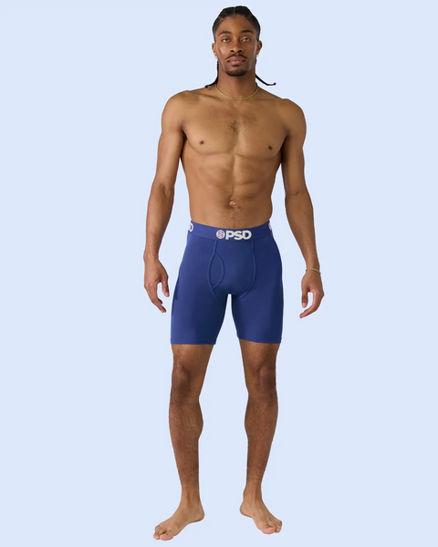 Man wearing navy blue boxer briefs with PSD waistband.
