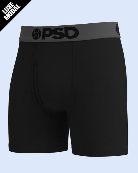 Black boxer briefs with grey PSD waistband and logo on light blue background.