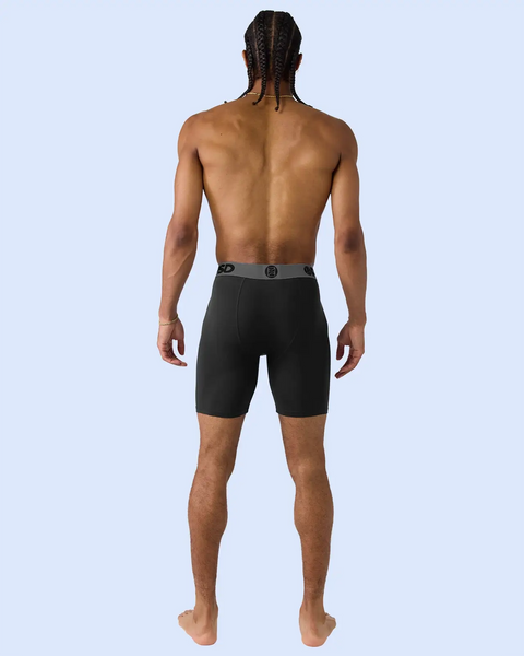 Black boxer briefs with grey waistband shown on back view of male model.