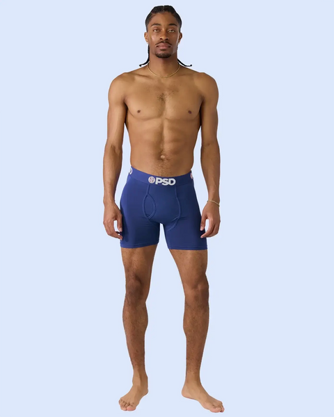 Man wearing navy blue boxer briefs with PSD waistband.