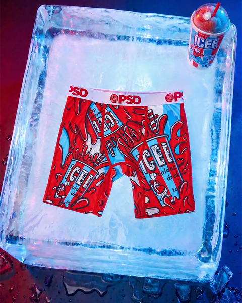 Red and blue ICEE-patterned boxer shorts with PSD waistband displayed in ice block with frozen drink.
