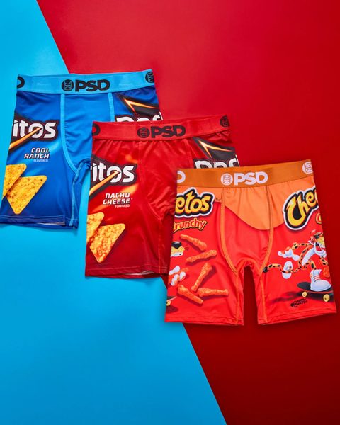 Three PSD brand underwear briefs featuring Doritos and Cheetos snack packaging designs in blue, red, and orange.