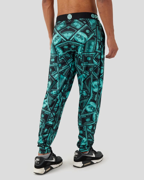 Men's lounge pants with teal and black currency pattern, black waistband with branded detail.