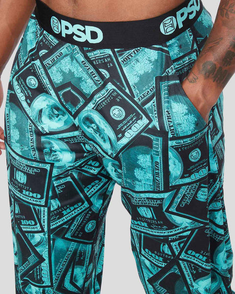 Lounge pant with turquoise and black dollar bill print, black waistband with PSPD branding, and side pockets.