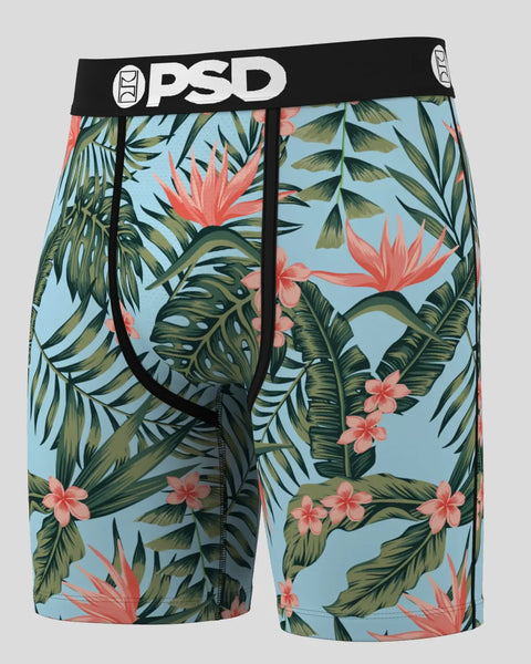 Three pairs of men's boxer briefs with tropical leaf and flower print on light blue background and black waistband.