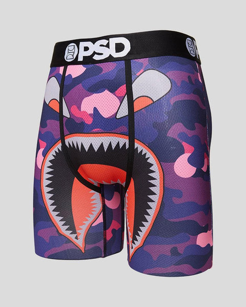 PSD boxer briefs with purple, pink, and navy camouflage pattern and cartoon monster face graphic with sharp teeth and white e