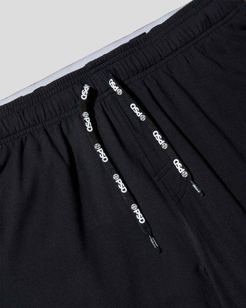 Black jogger pants with elasticated waistband and branded drawstring details.