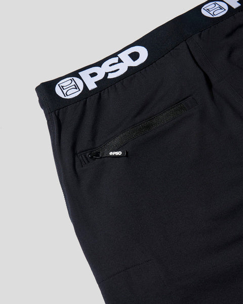 Black joggers with white PSD branded waistband and front pocket detail.