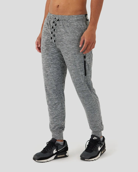 Grey heathered joggers with drawstring waist, side zip pocket, and tapered cuffs on male model.