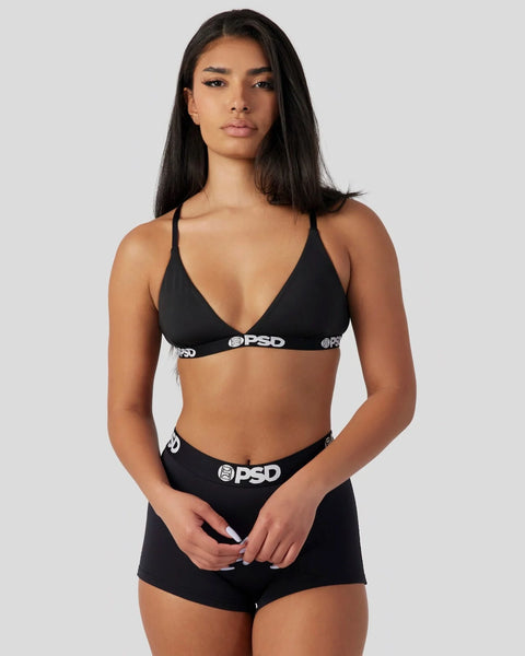 Black bra and shorts set with PSD branding on elastic waistbands.