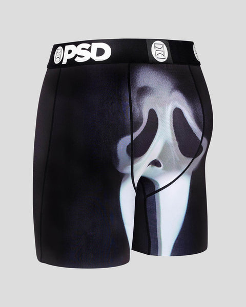 Black PSD boxer briefs with glow-in-the-dark ghost face design on front panel.
