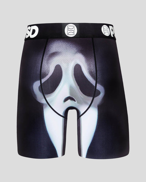 Black shorts with glow-in-the-dark ghost face print and branded waistband.