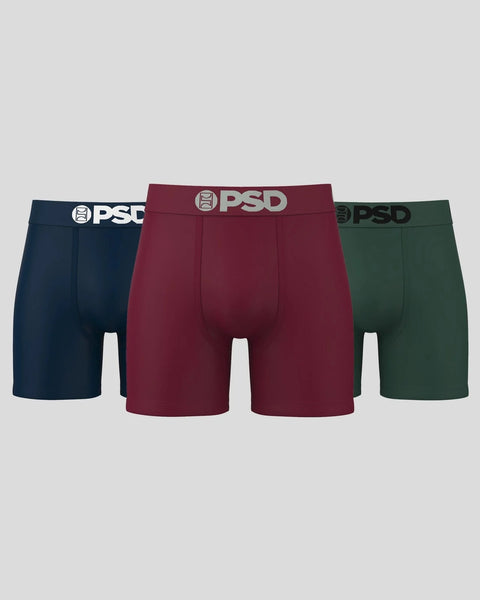 Three PSD brand boxer briefs in navy, burgundy, and forest green with white waistbands.