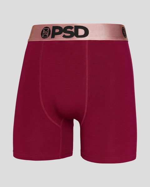 PSD boxer brief with burgundy body, rose gold metallic waistband, and black logo.