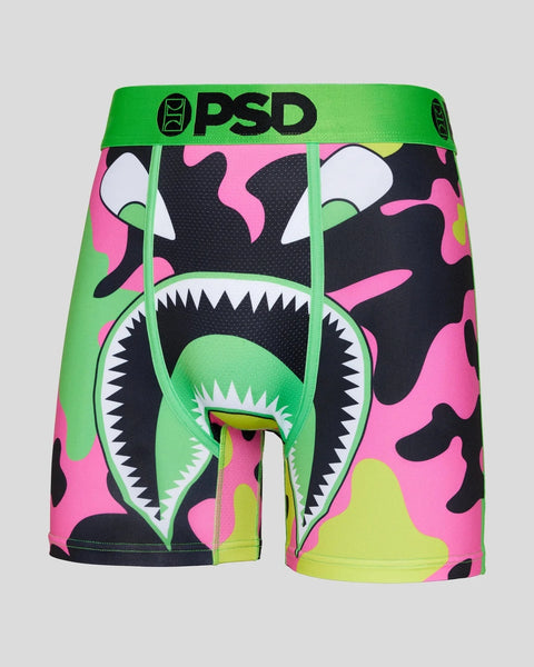 PSD boxer briefs with neon green waistband and camouflage pattern in pink, black, yellow, and white with monster face graphic