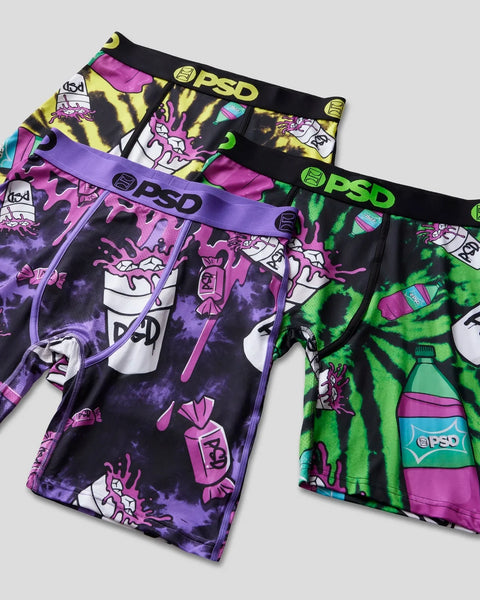 Three PSD brand boxer briefs with colorful tie-dye and graphic print designs in yellow, purple, and green.