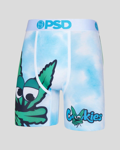 PSD brand boxer shorts with blue sky background and green cartoon character design with "Cookies" text.