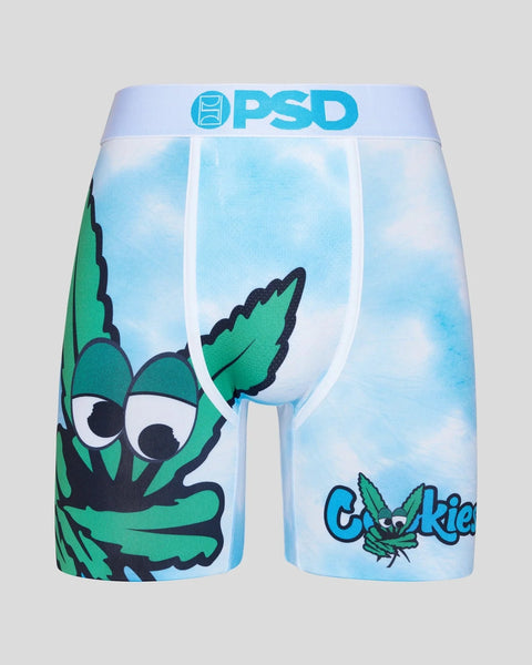 PSD brand shorts with light blue sky background, green cartoon character with large eyes, and "Cookies" text.
