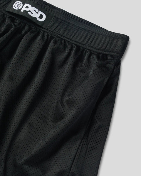 Black mesh athletic short with perforated ventilation and white brand waistband label.