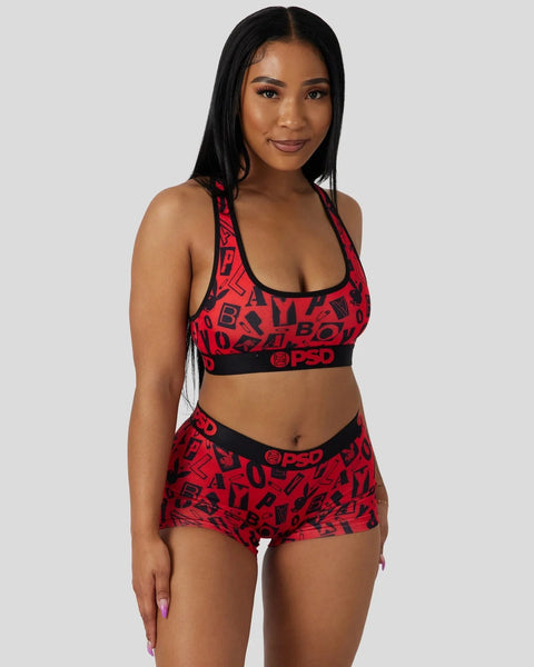Red and black Playboy Anarchy sports bra and shorts set with all-over logo print and PSD waistband.