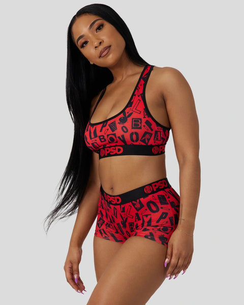 Red and black Playboy Anarchy sports bra and boy shorts set with allover logo print and branded waistband.