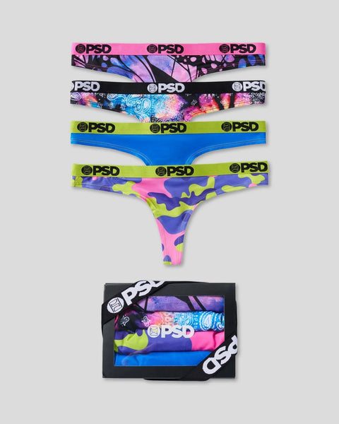 Four PSD underwear pairs in pink/purple abstract, black/multicolor galaxy, blue solid, and neon camo prints with branded wais