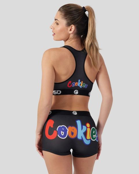 Woman wearing black sports bra and shorts set with colorful 