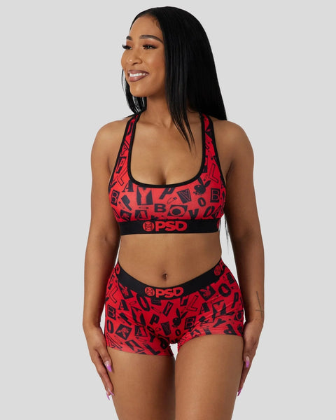 Red and black Playboy Anarchy sports bra and shorts set with all-over logo print and PSD waistband.
