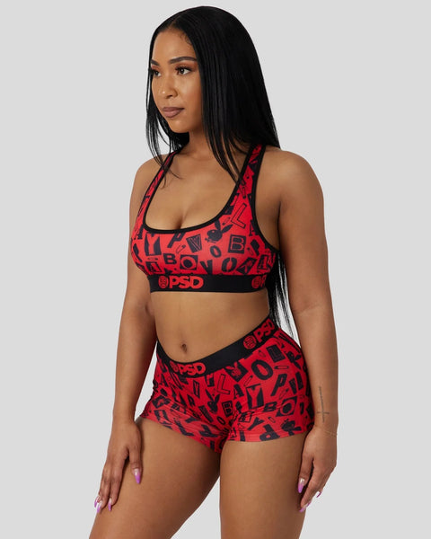 Red and black Playboy Anarchy sports bra and shorts set with repeating logo pattern and PSD waistband.